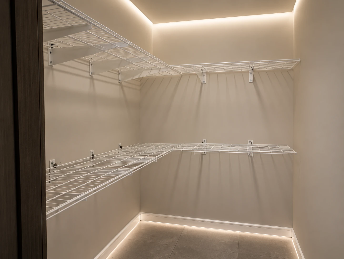 White wire wall shelving installed in a storage room